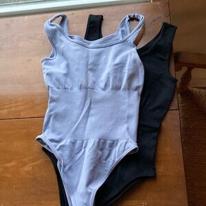 OQQ body suits in black and light blue